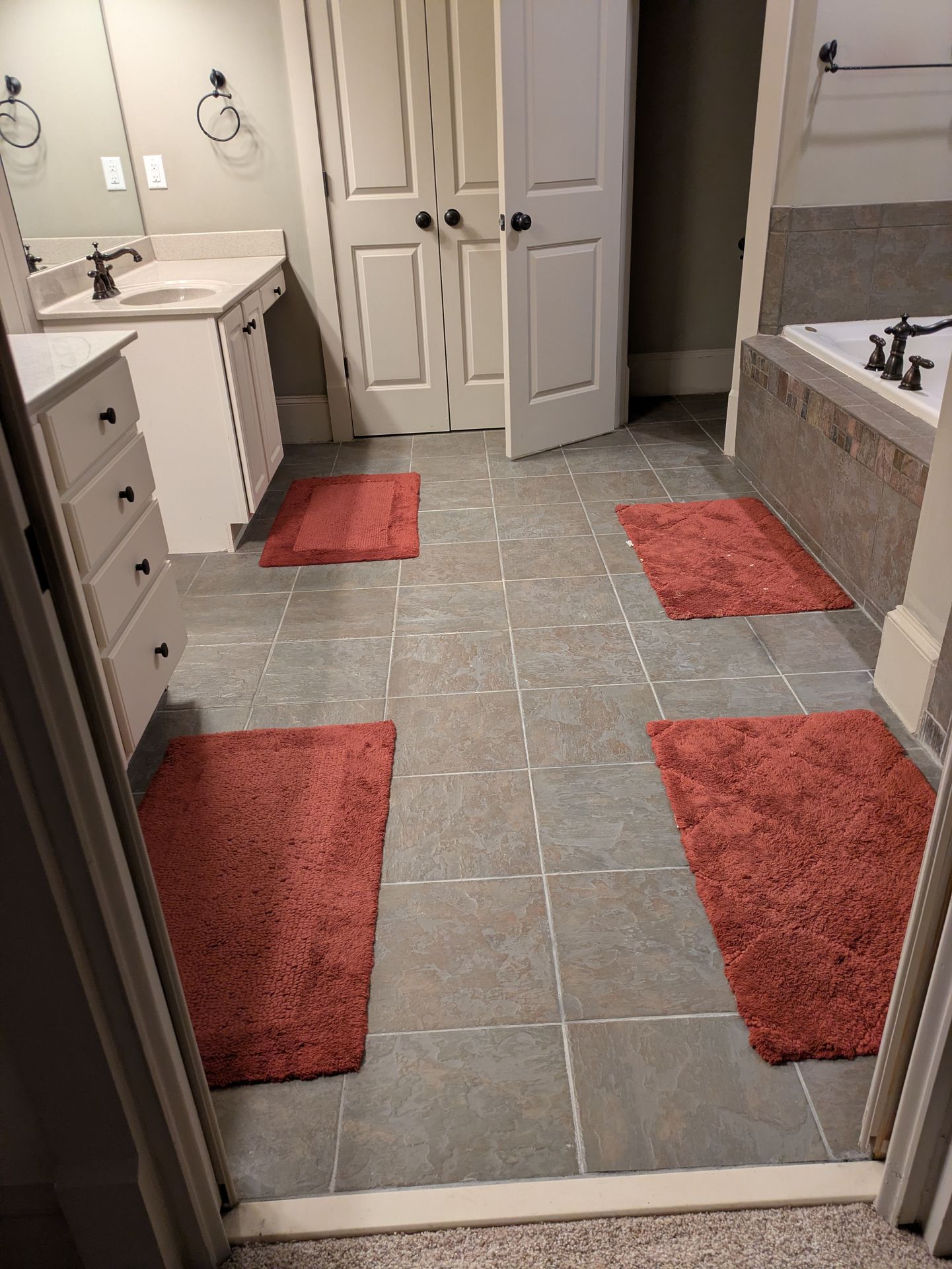 Completed grey tile floor in a modern Athens GA bathroom remodel